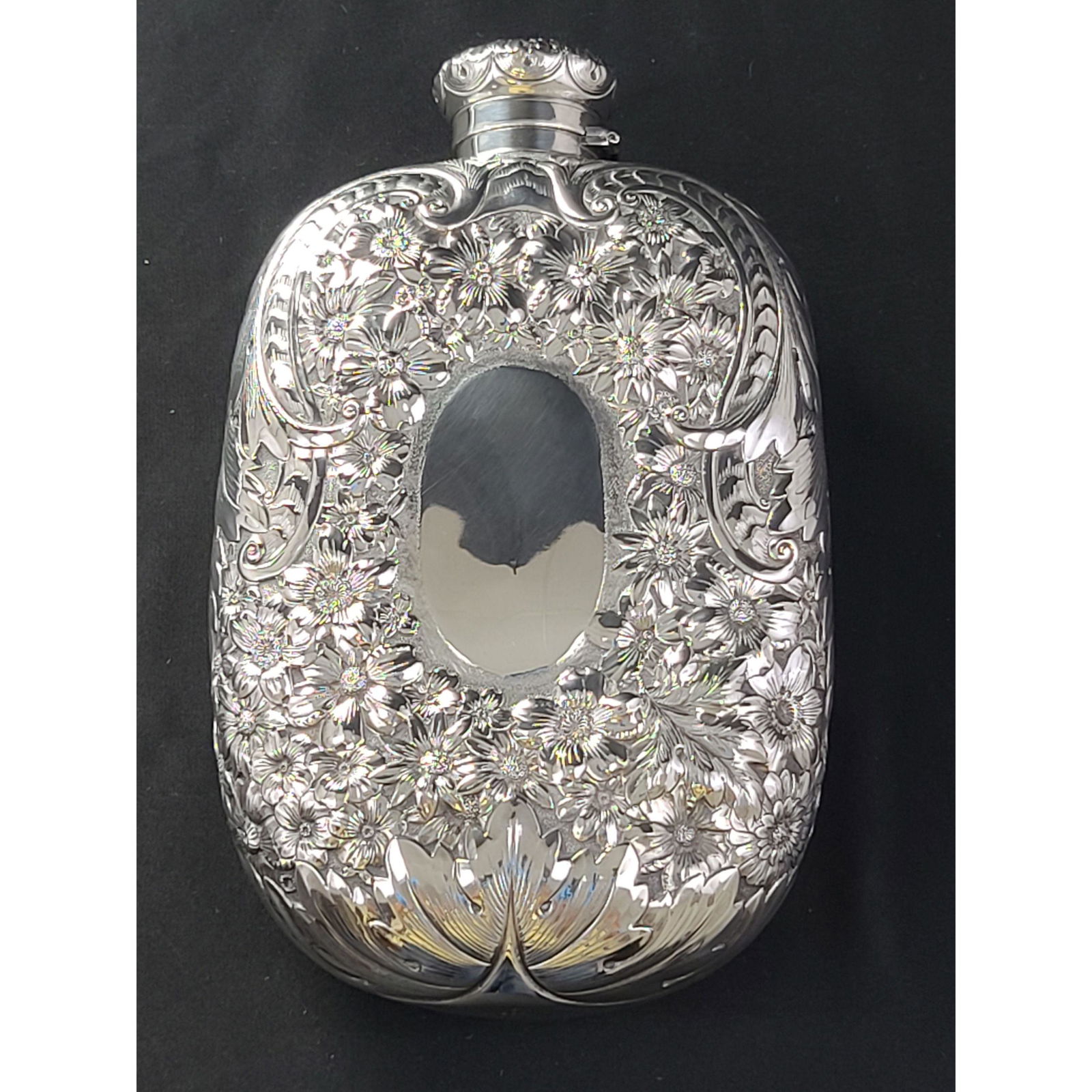 Extremely large Gorham silver repousse whiskey flask: Extremely large Gorham silver repousse whiskey flask with an original corkscrew top, fantastic condition. Measures 8 1/2" x 5 1/2" x 2 1/2" 455 grams