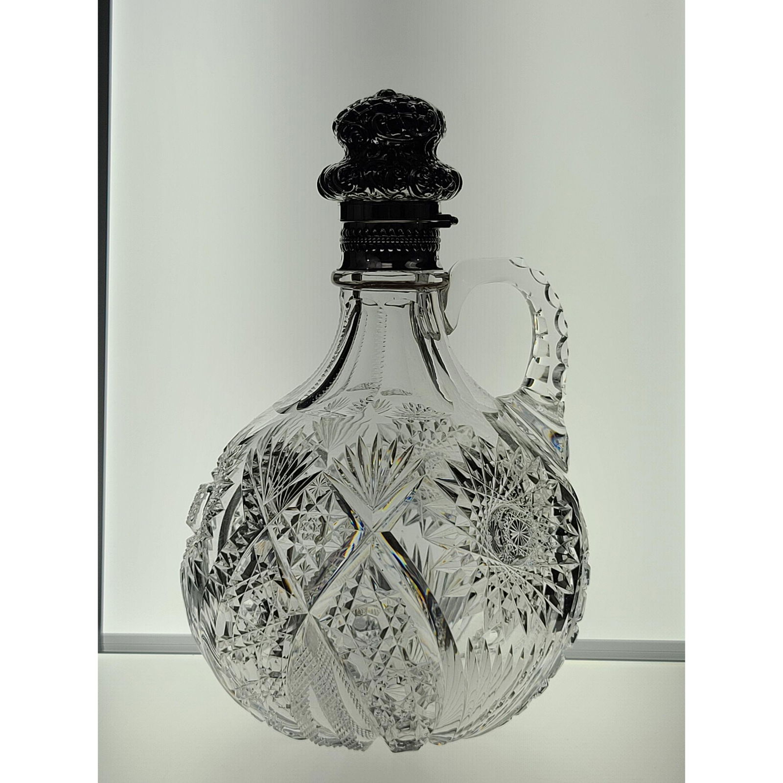 ABP whiskey jug, HAWKES "Chrysanthemum" pattern with: ABP whiskey jug, HAWKES "Chrysanthemum" pattern with Gorham silver repousse screw-top. Measures 8 1/2"