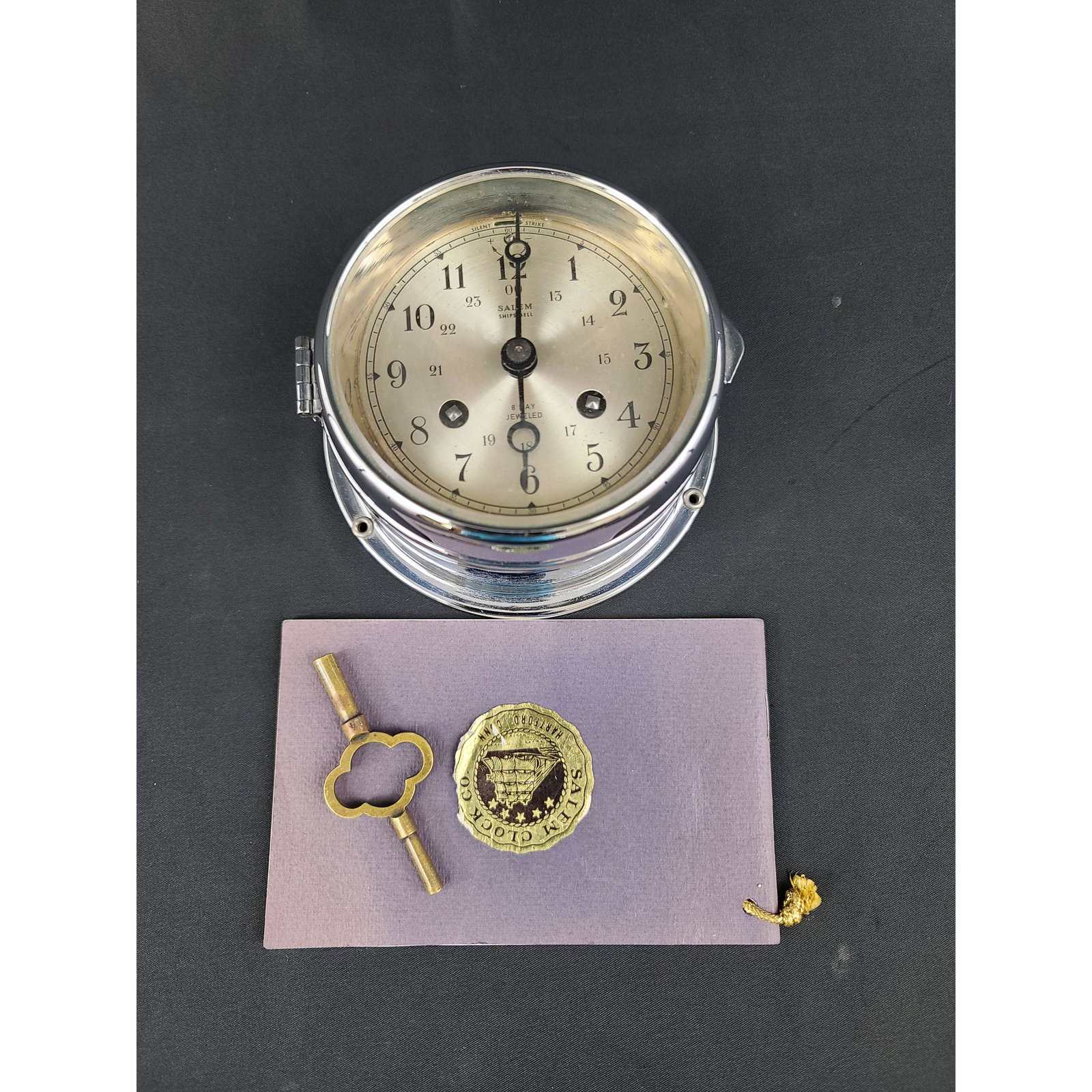 Salem Clock Co Clock, Salem Ship's Bell: Salem Clock Co Clock, Salem Ship's Bell. Measures 4 3/4" x 2.5"