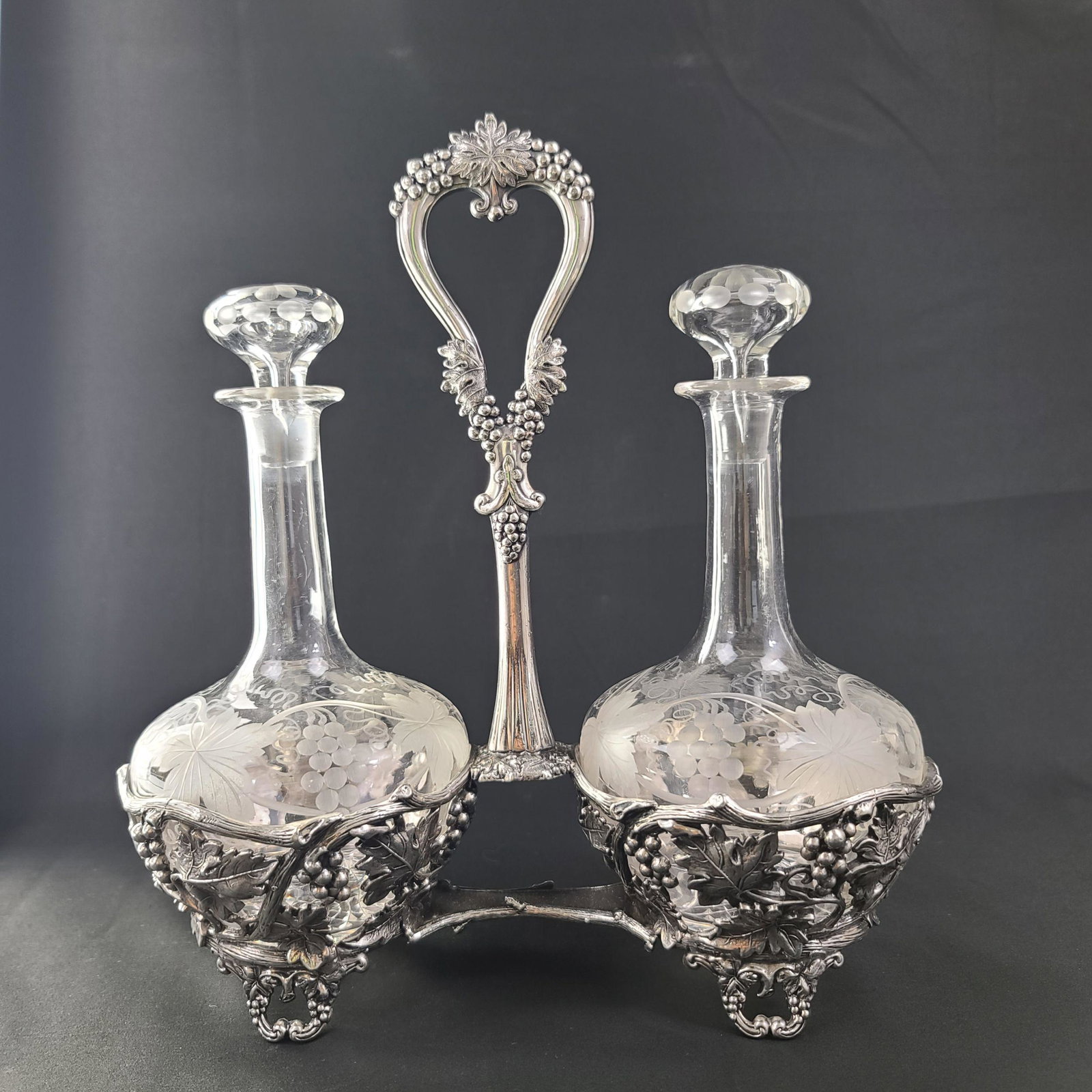 Vintage PAIRPOINT Double Bottle Liquor Set: Vintage Pairpoint Double Bottle liquor Set in Silver-plate frame. Pictured In The Pairpoint Glass Shapes & Pattern- Frost P.146. Measure 10 3/4" Tall X 10" x 4.5"