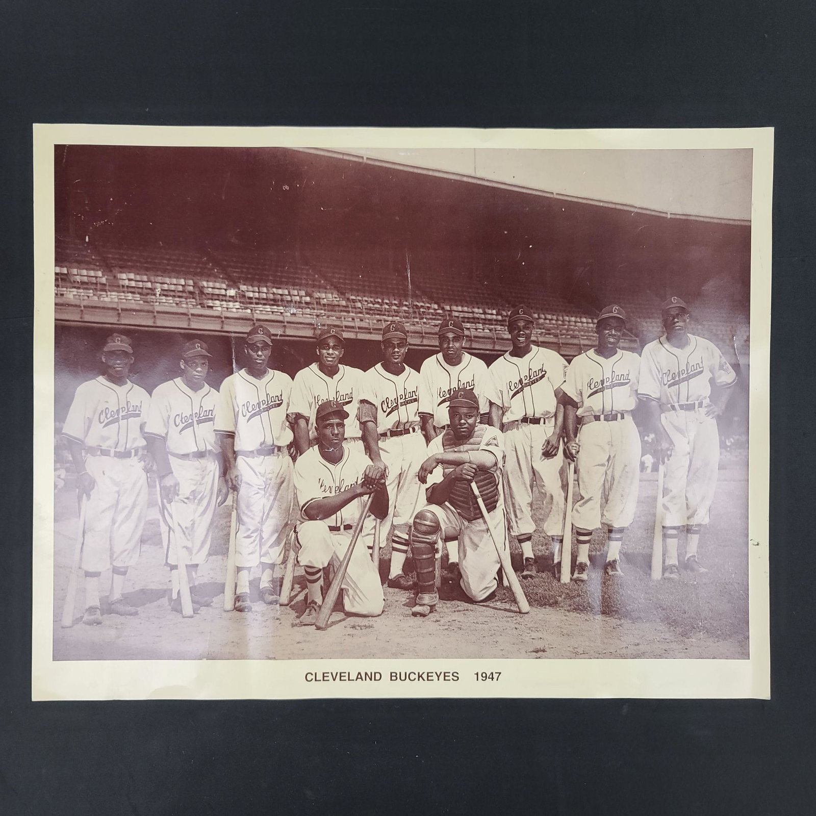 1947 Cleveland Buckeye Baseball Team Photograph Print: Vintage 1947 Cleveland Buckeyes team photograph Print. Image of the Negro American League Champion Buckeyes posed in full uniform. Players include Troupe, Jones, Jethro, Brewer, Williams, and Grace. T