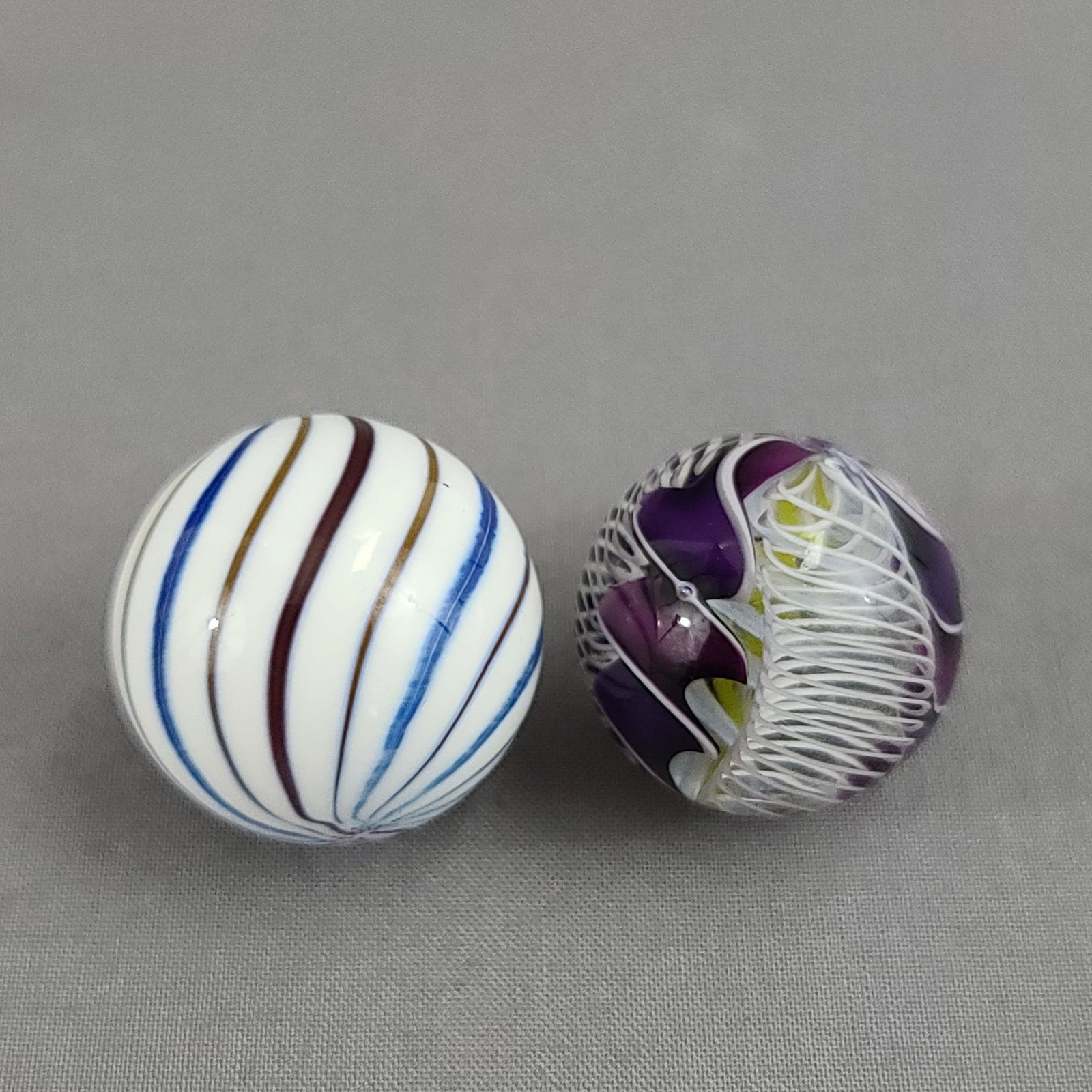 2 Vintage Glass Marbles: 2 Vintage Glass Marbles. Measures 1" & 1 1/8"