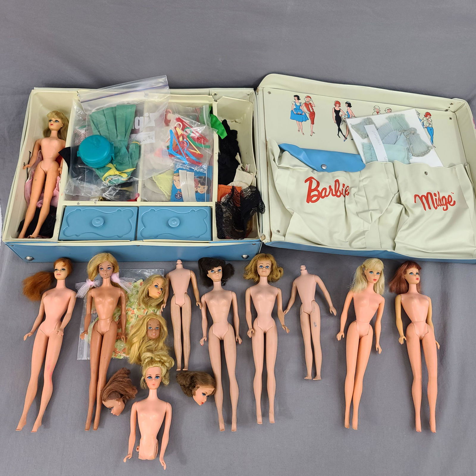 VINTAGE BARBIE DOLL LOT: A large lot of assorted Barbie dolls and outfits in a trunk. Dolls range in conditions from tlc to good vintage conditions. Trunk includes mod dolls, ponytail, midge and others. Lots of tagged Barbie