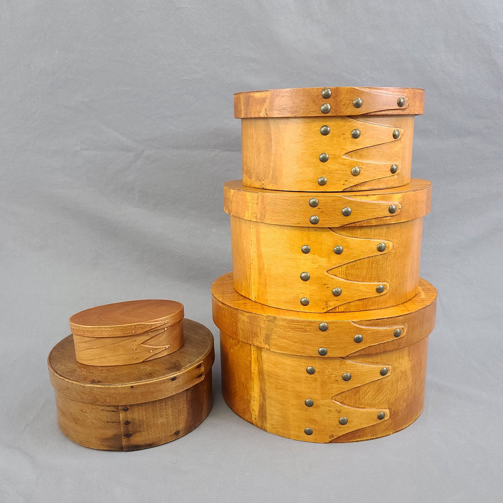 Group of Shaker Boxes, also includes a Music Box: Group of Shaker Boxes, One Old, and 3 New. Also includes a Music Box. The boxes measures 7 1/4, 7 3/4 , 8 3/4, and 10".