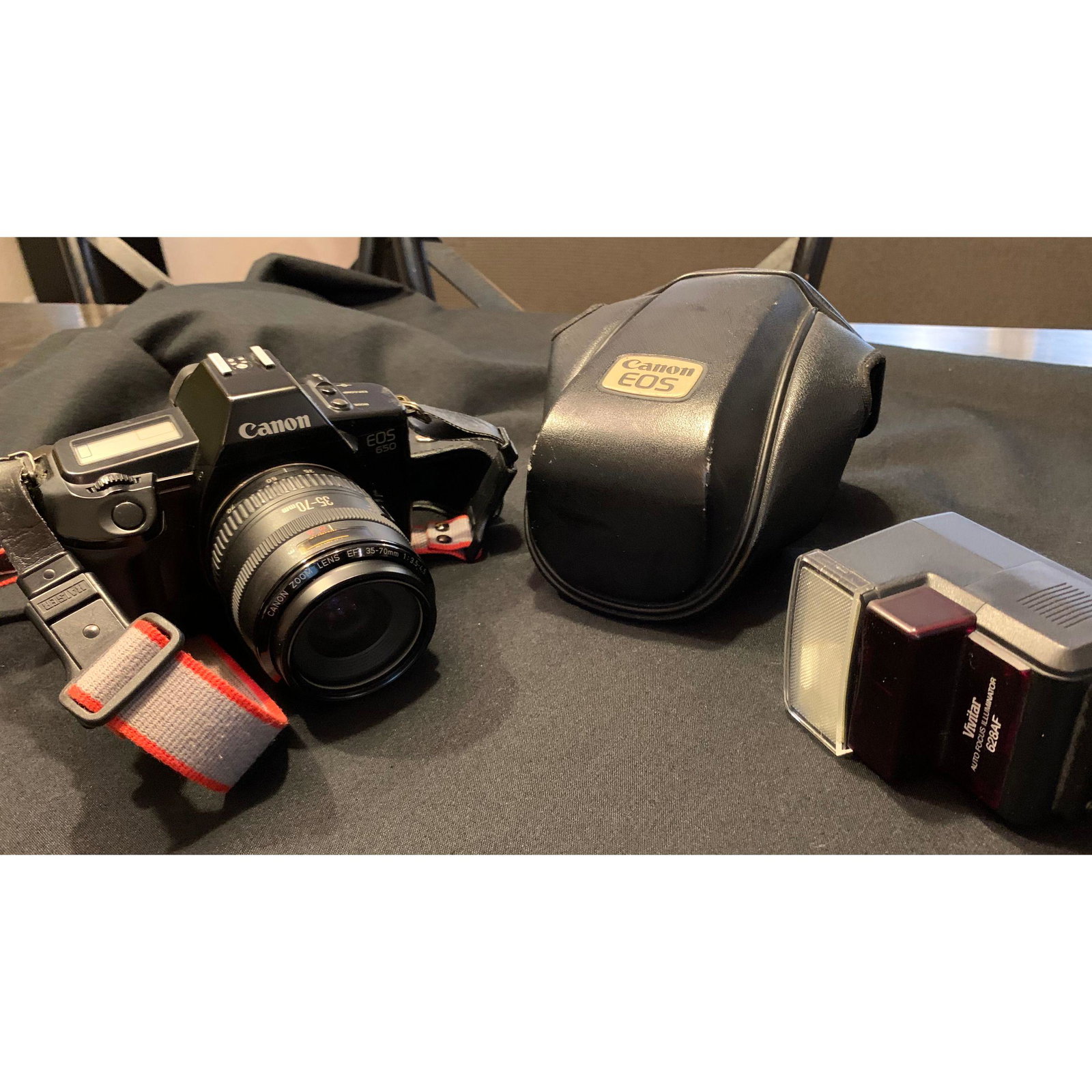 Canon Camera EOS 650 Lens- 35-70mm **: ** Reserve is $50.00** Canon Camera EOS 650 Lens- 35-70mm. Comes with a Hard Case, and Vivitar Flash Auto Focus 628AF Illuminator