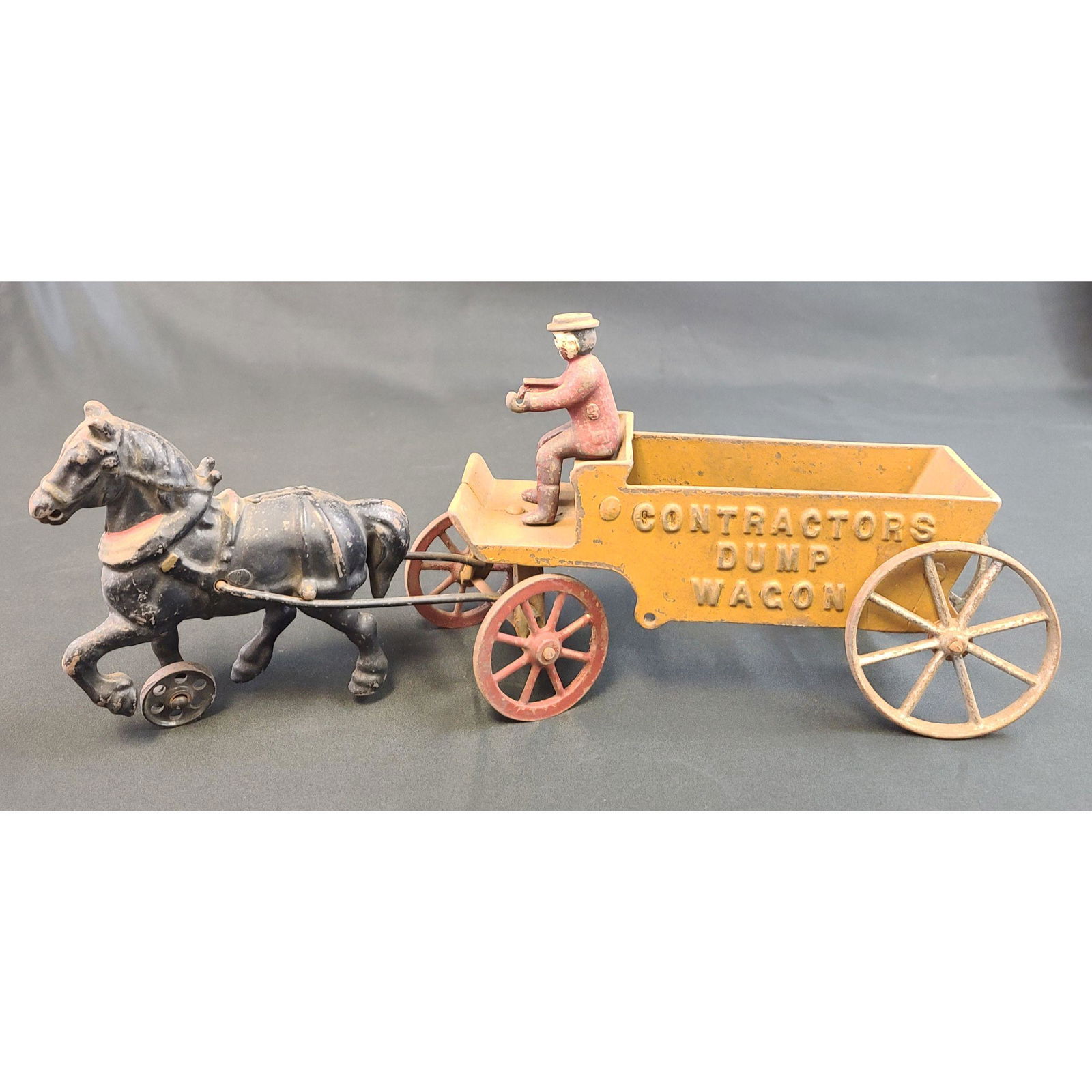 Antique Cast Iron Wagon TOY "CONSTRUCTION DUMP WAGON": Antique Cast Iron Wagon TOY "CONSTRUCTION DUMP WAGON". MEASURE APPROX. 14" LONG.