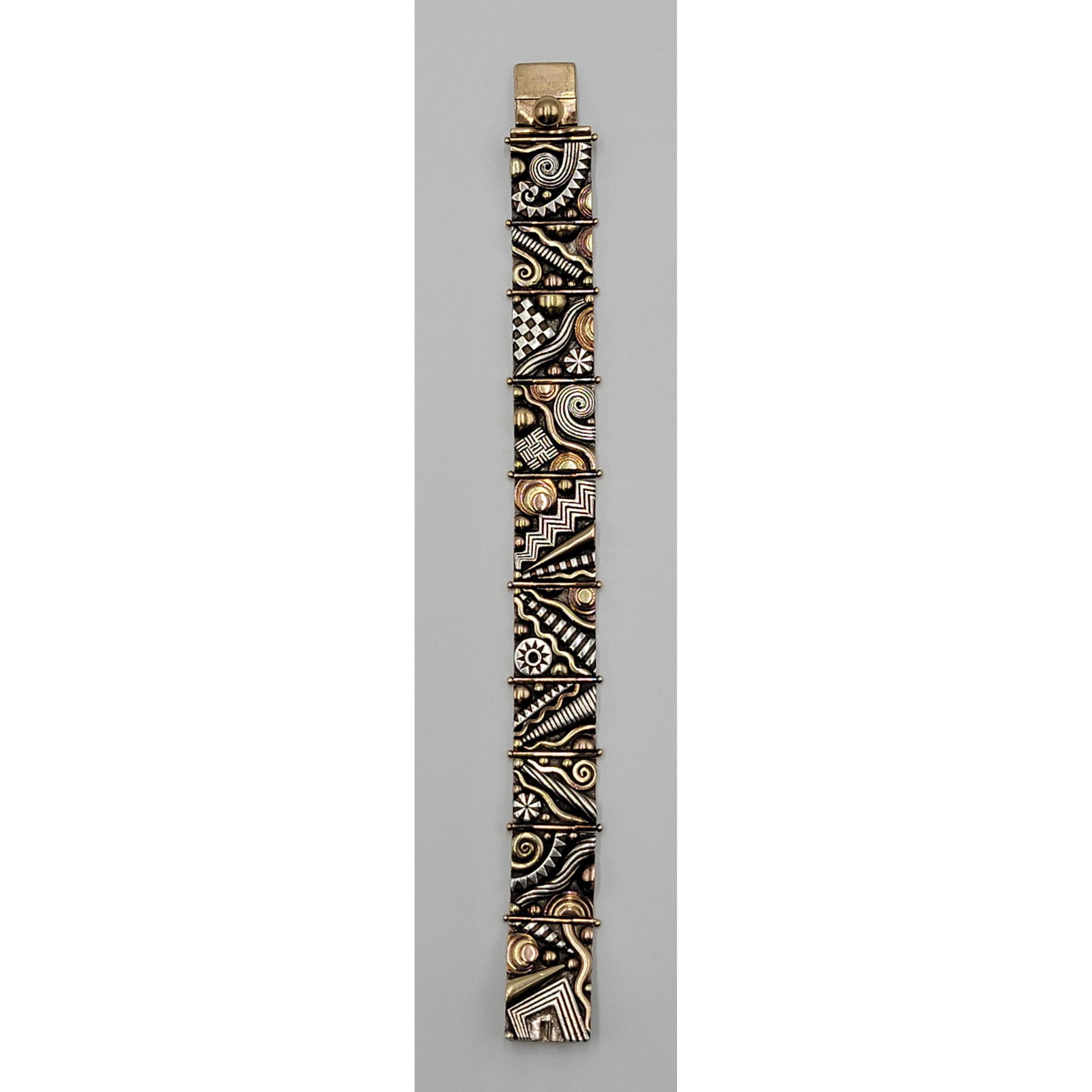 Sterling Silver And Gold Signed Aaron Macsai Bracelet: Sterling Silver And Gold Signed Aaron Macsai Bracelet. The base metal is Silver And The Colored Pieces Are Tested For Gold