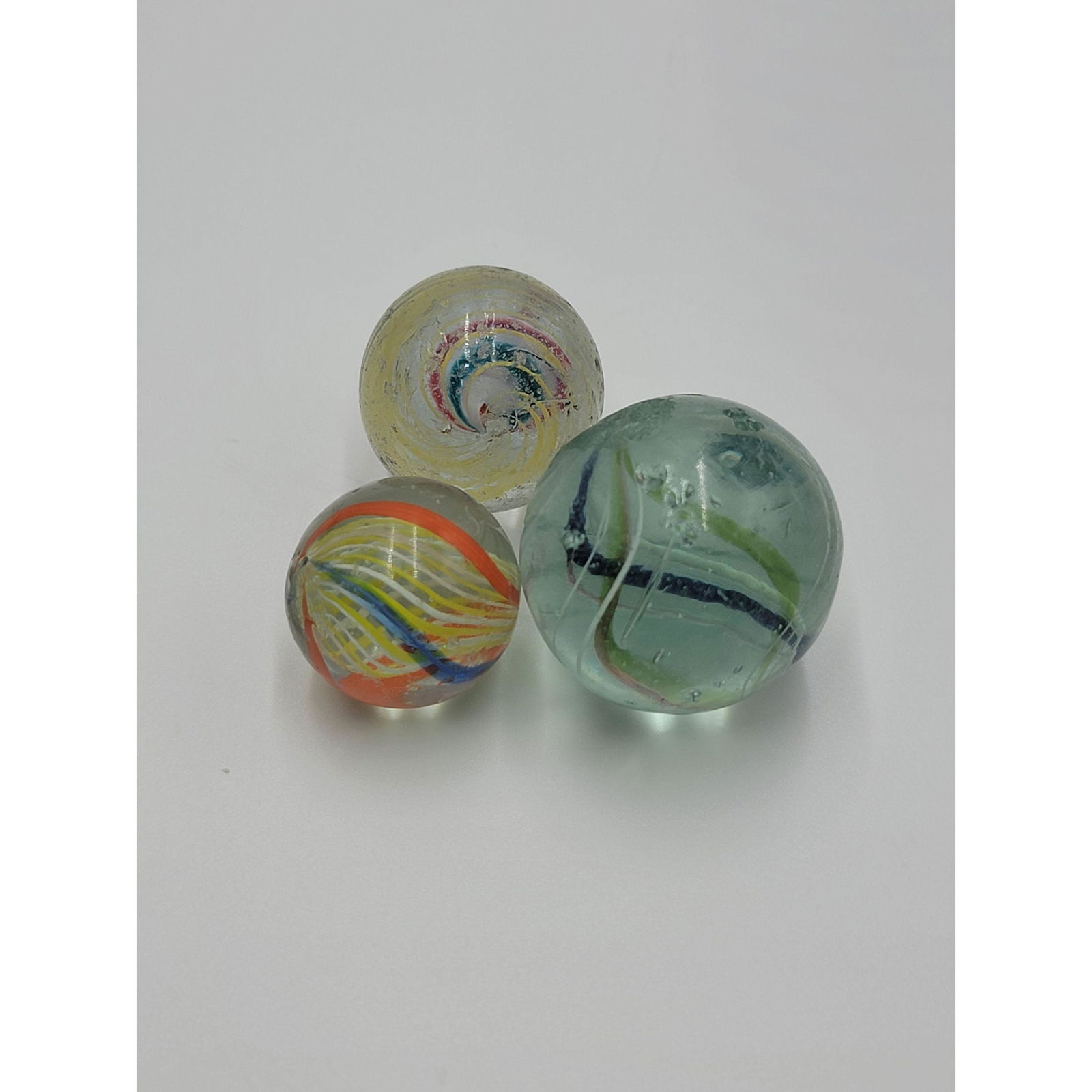 Lot of 3 Vintage Marbles: Lot of 3 Vintage Marbles, the marbles measure from 3/4" to 1" Across.