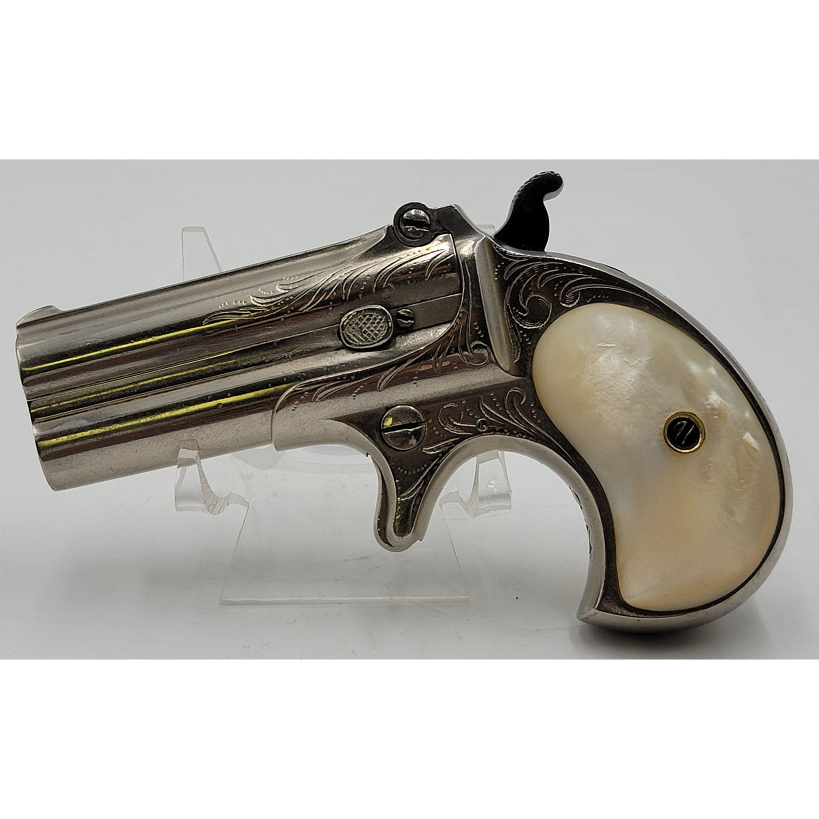 Antique E. Remington & Son's Elliot's Derringer 1865 P: Antique E. Remington & Son's Elliot's Derringer Pat 1865. Model 95 Over-Under, Double Barreled Derringer, single action. Engraved nickel finish with mother of pearl handle. Produced between 1880-88.