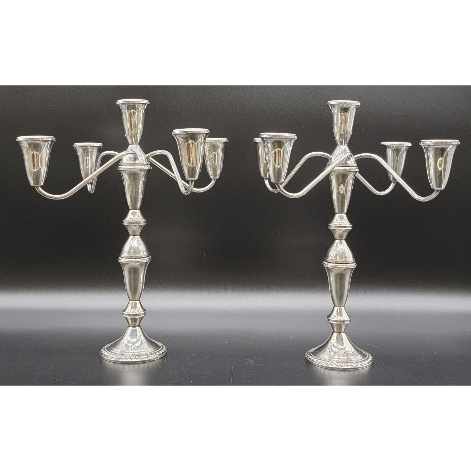 A Nice Pair OF Sterling Silver Candelabra: A Nice Pair OF Sterling Silver Candelabra. Measure 13.5" Tall x 12" Across. Total Weight Please carefully read our terms of sale, shipping information, and request any condition reports or photos prio