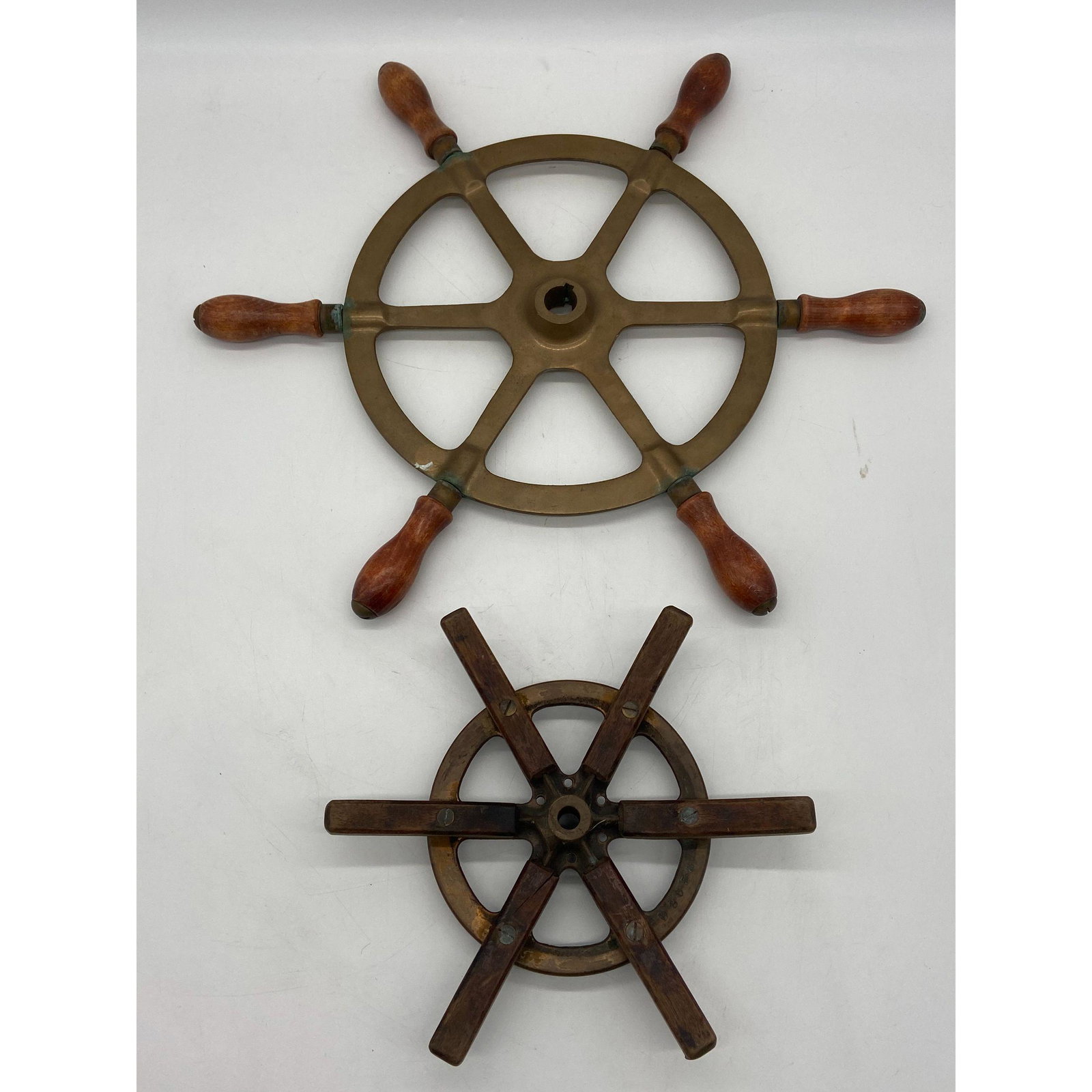 Vintage Pair Of Ship Wheels: Vintage Pair Of Ship Wheels...Please carefully read our terms of sale, shipping information, and request any condition reports or photos prior to placing a bid. Any condition statement is given as a c