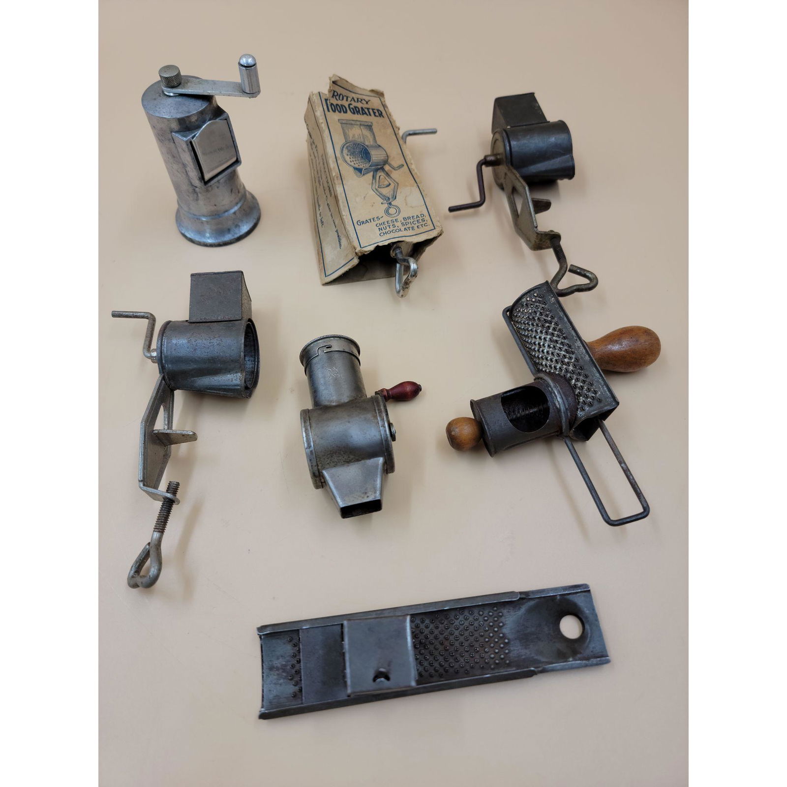A Grouping Of Antique Food Graters Some Unusual: A Grouping Of Antique Food Graters Some Unusual. Please carefully read our terms of sale, shipping information, and request any condition reports or photos prior to placing a bid. Any condition statem