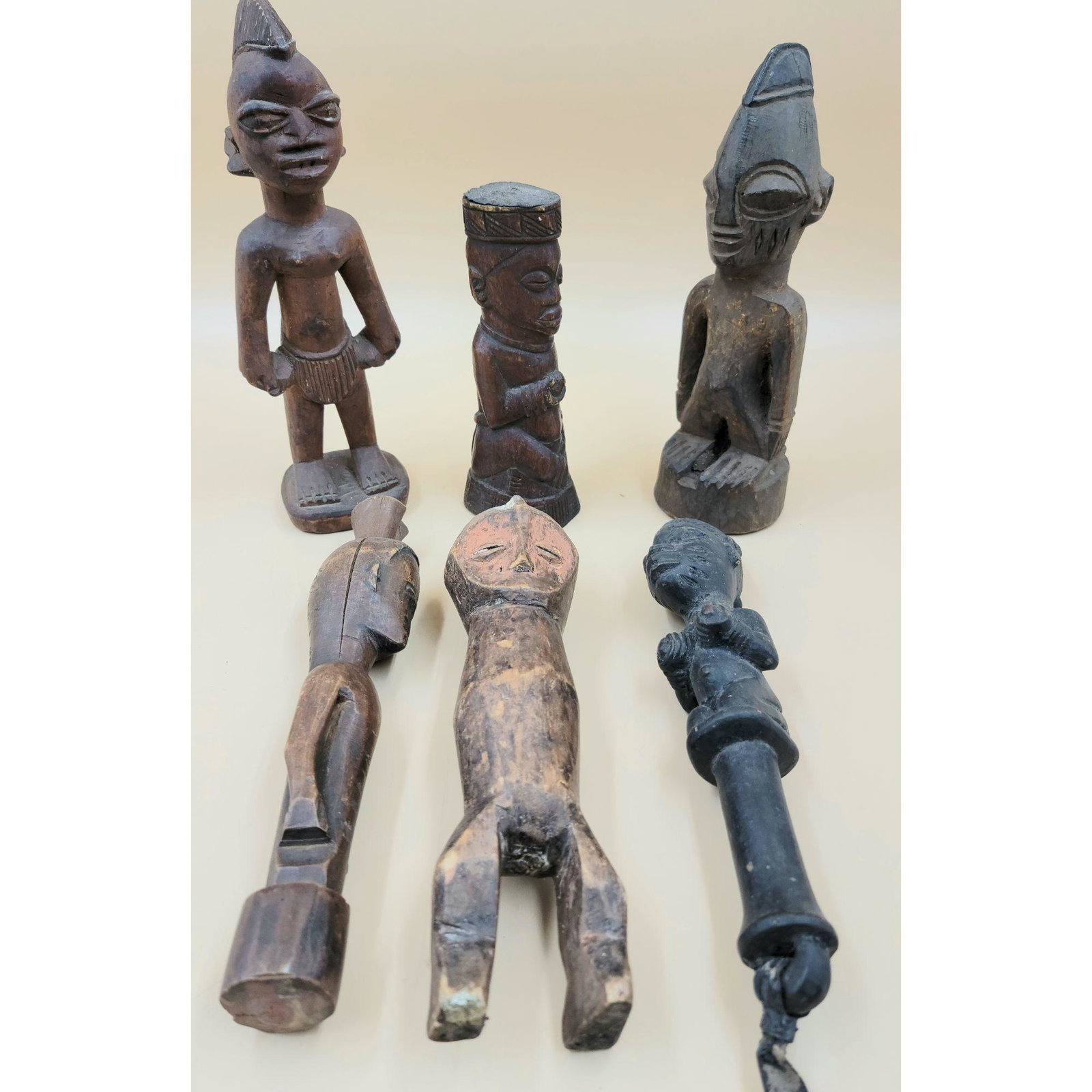 A lot of African Yoruba, Lega and Kuba Figures, 1 Bone: A lot of African Yoruba, Lega and Kuba Figures, 1 Bone. Group Of 5, ranging in size from 7." To 10.5" tall. This lot, and more forthcoming, are from the estate of a true antiquity connoisseur in every