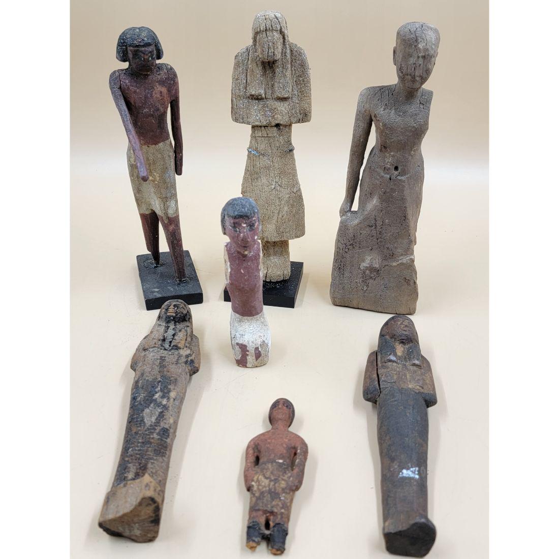 A grouping Of Ancient Egyptian Wood Figures (7) Includes Wooden Soldiers Or Boatman Funerary Figures: (THIS IS A RARE SLEEPER LOT DO NOT MISS OUT) A grouping Of Ancient Egyptian Wood Figures (7) Includes Wooden Soldiers Or Boatman Funerary Figures MIDDLE KINGDON 11-12TH DYNASTY, CA 2134-1778 B.C, One 