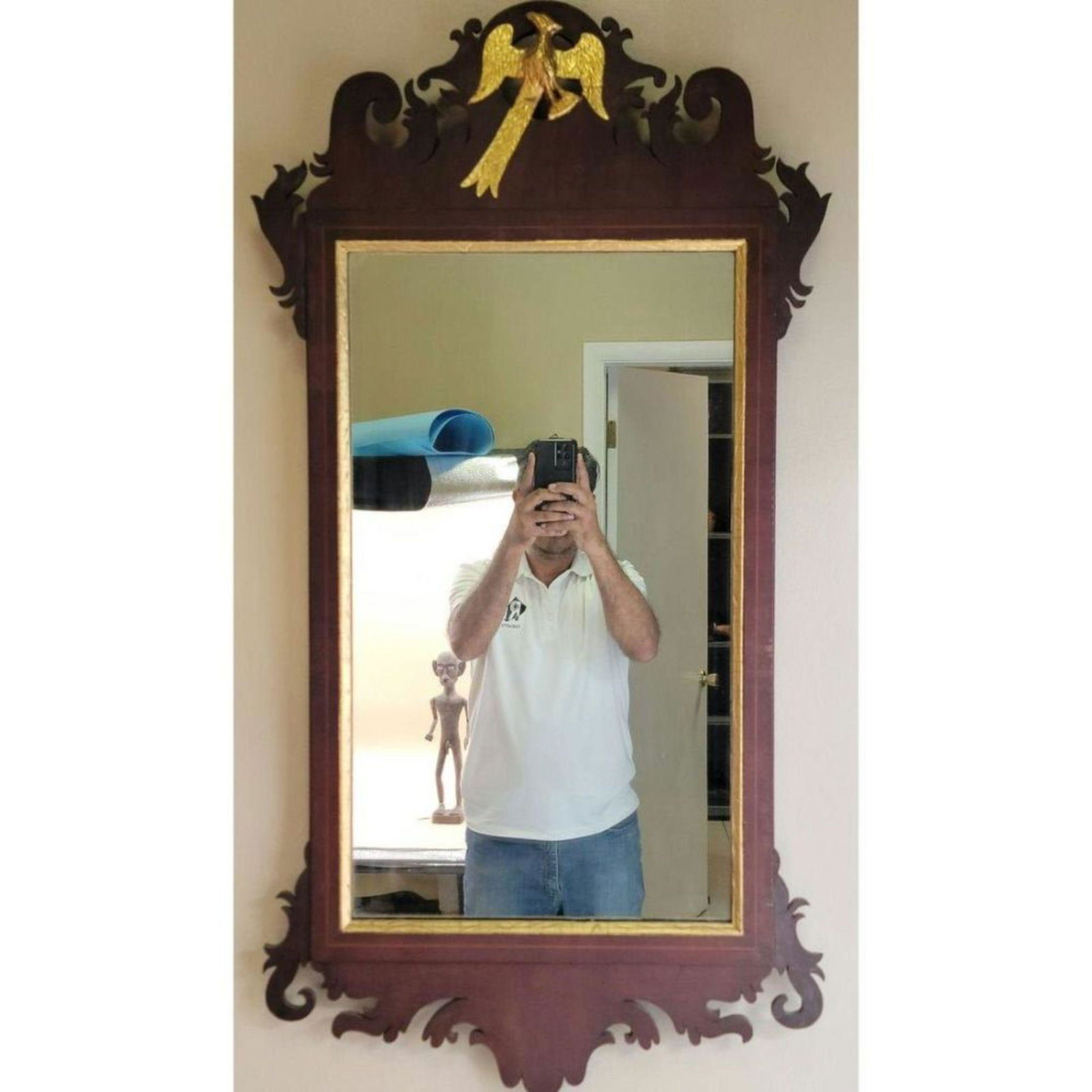 C1780 Chippendale Mahogany Scroll Mirror W/ Gilt Bird: C1780 Chippendale Mahogany Scroll Mirror W/ Gilt Bird (NOT PERFECT). Measure 42" X 21.5". This lot, and many forthcoming are from the estate of a true antiquity connoisseur in every sense of the word.