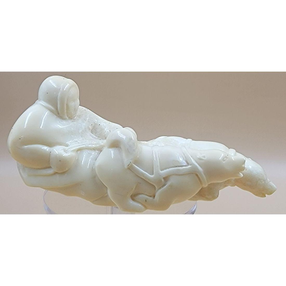 An Eskimo Carving, 2 Polar Bears Pulling A Person (Oosik): An Eskimo Carving, 2 Polar Bears Pulling A Person (Oosik). Measures 5" Long. This, and many lots forthcoming were found at the massive central Florida estate of a true antiquarian who amassed his magn
