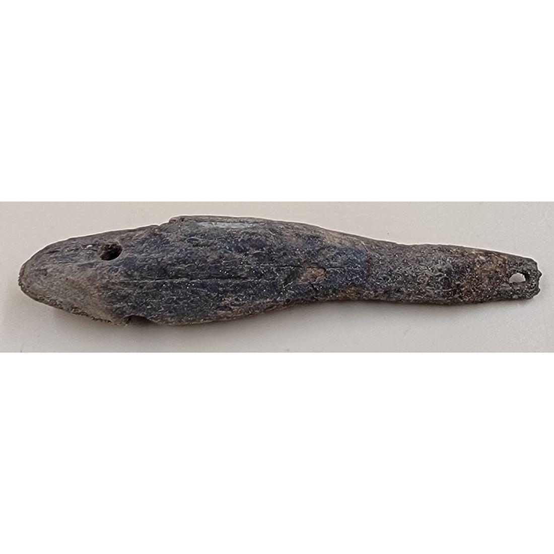 A Pre Historic Fossilized Inuit Fishing Lure: A Pre Historic Fossilized Inuit Fishing Lure. Measure 3 1/4". This, and many lots forthcoming were found at the massive central Florida estate of a true antiquarian who amassed his magnificent collect