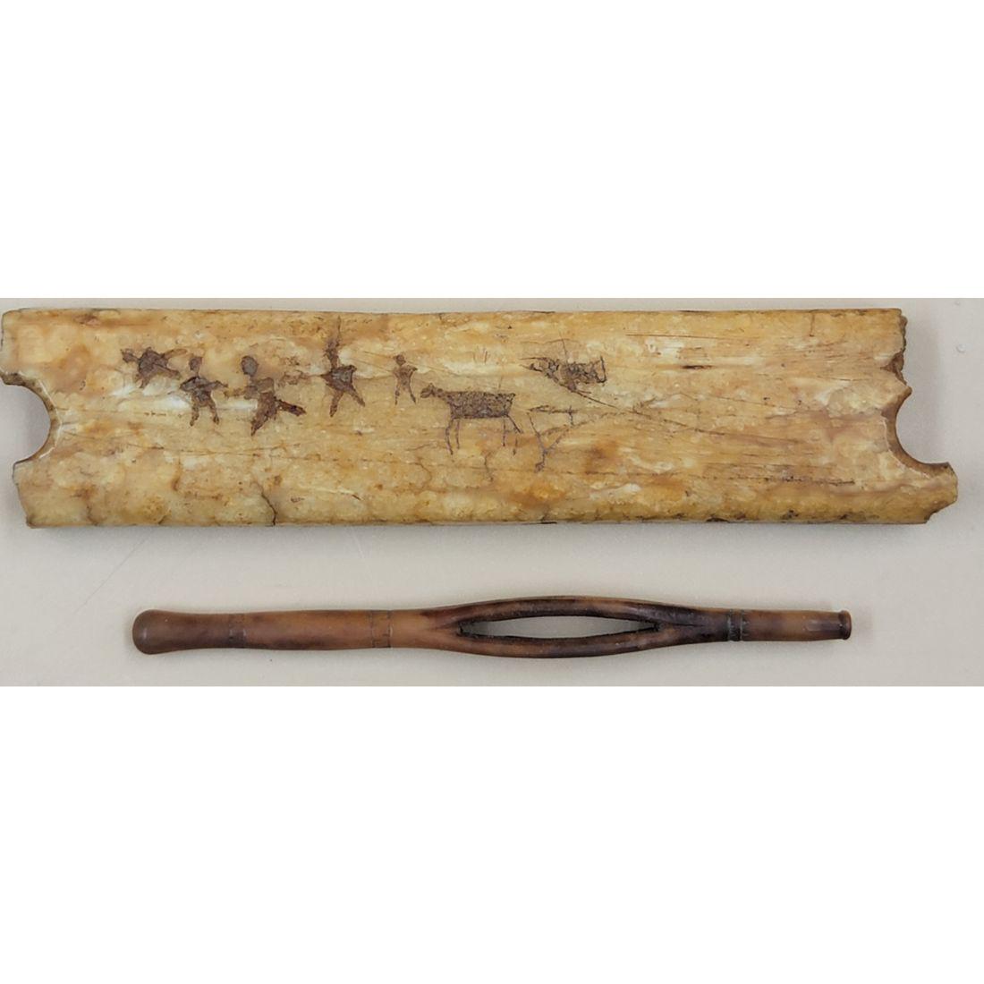 A Pre Historic Carved Drawing On Fossilized Bone: A Pre Historic Carved Drawing On Fossilized Bone. Measure 3 3/4" X 3/4" X 1/4". This, and many lots forthcoming were found at the massive central Florida estate of a true antiquarian who amassed his m