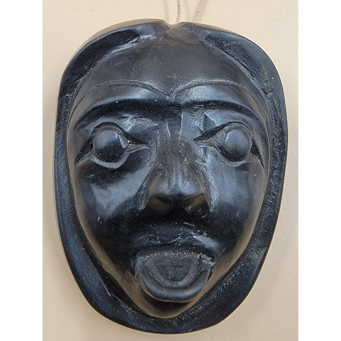 Haida Sculpture Of A Face , Haida Pendant Argillite, Annotation On Backside: Haida Sculpture Of A Face. Measure 2.60" X 2.07" X 1.22". This, and many lots forthcoming were found at the massive central Florida estate of a true antiquarian who amassed his magnificent collection 