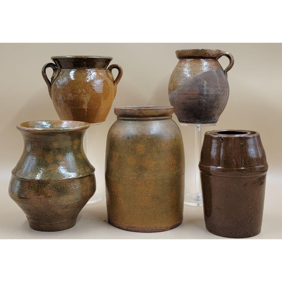 A Grouping Of Redware / Stoneware Pottery (5 Pcs): A Grouping Of Redware / Stoneware Pottery, Various Sizes. FROM THE ESTATE OF THE LATE ROBERT RUEBSAMEN. Measure 11 3/4". Please carefully read our terms of sale, shipping information, and request any