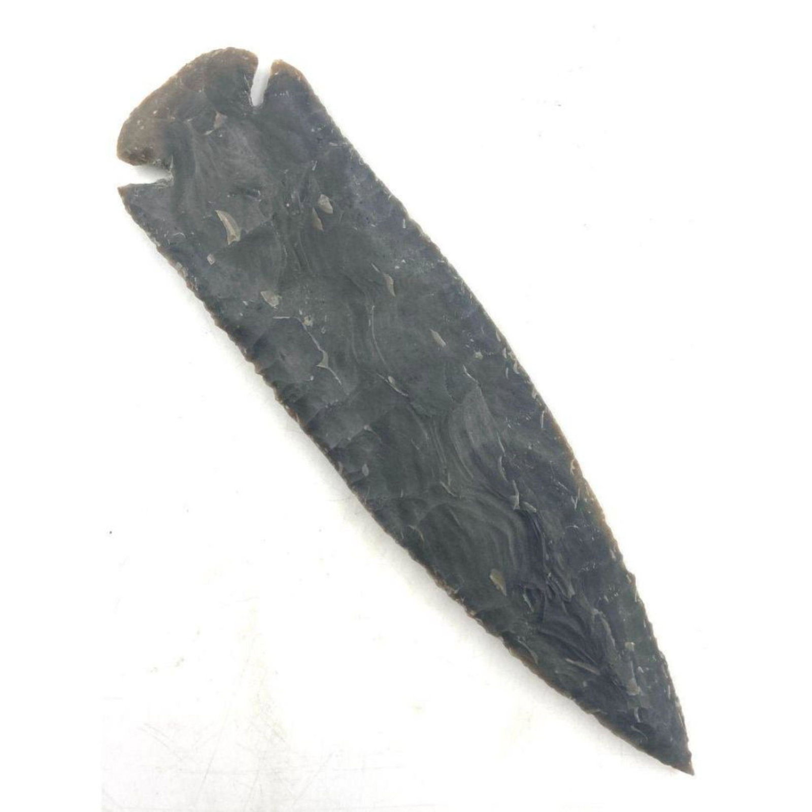 Stone Arrowhead Artifact Point Age Unknown: Stone Arrowhead Artifact Point Age Unknown, Measures 7 3/4" x 2". Comes From A Missouri collector. Please carefully read our terms of sale, shipping information, and request any condition reports or p