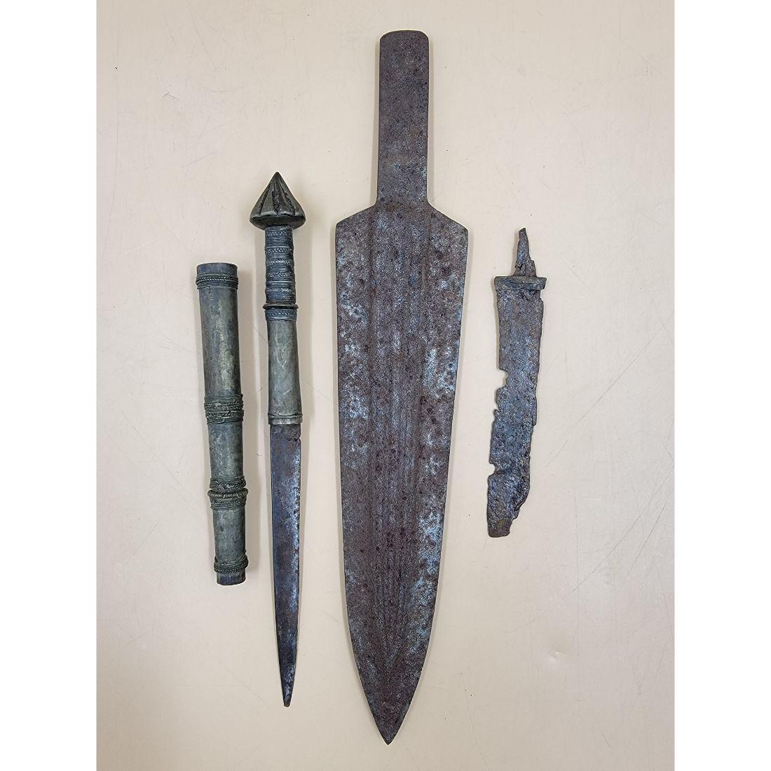A Grouping Of 3 Antique Knives, Roman Style Dagger, Old Viking Blade And Sheated Mid East Knife: A Grouping Of 3 Antique Knives. The large knife measures 13 1/2", the ancient one measures 6", and the last knife measures 10 1/4". This, and many lots forthcoming were found at the massive central Fl