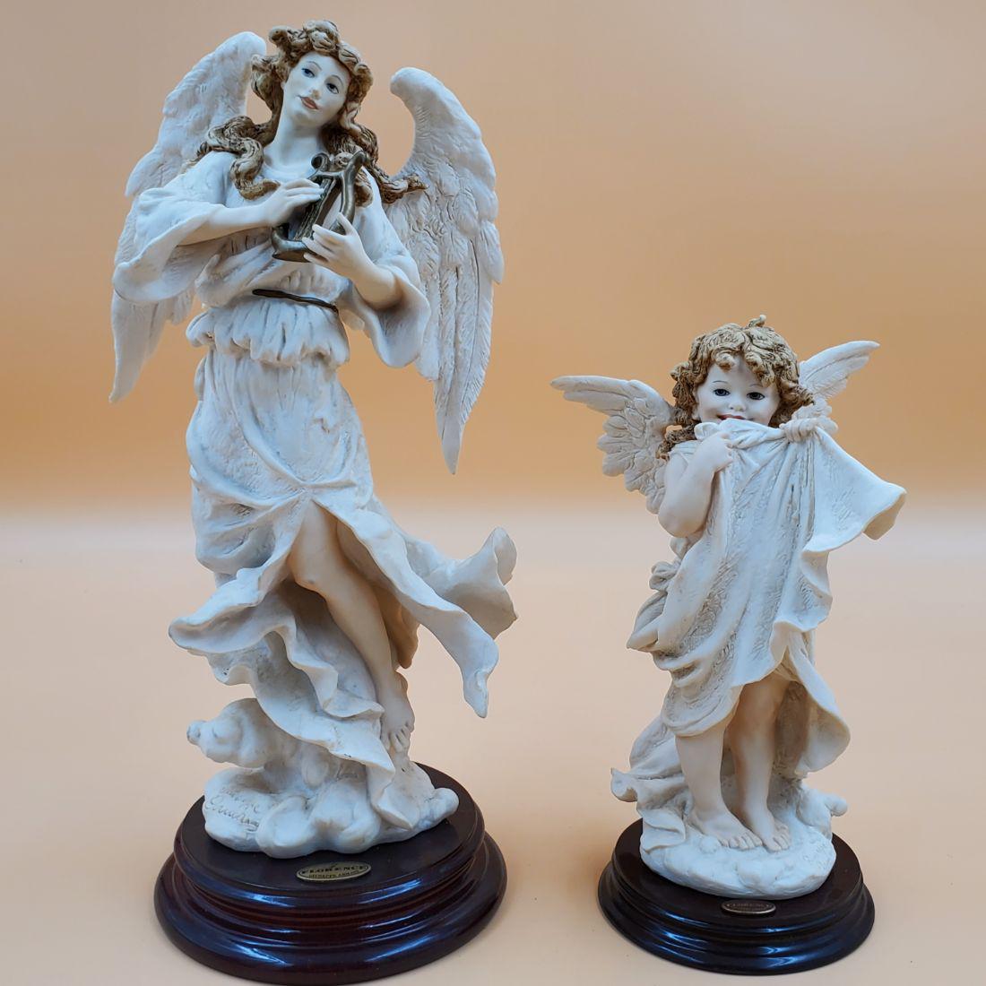 Giuseppe Armani Figurines: Heavenly Music & Heaven's Gift: Giuseppe Armani Figurines: Heavenly Music & Heaven's Gift. Both measures 13" & 9" Tall. Please carefully read our terms of sale, shipping information, and request any condition reports or photos prior