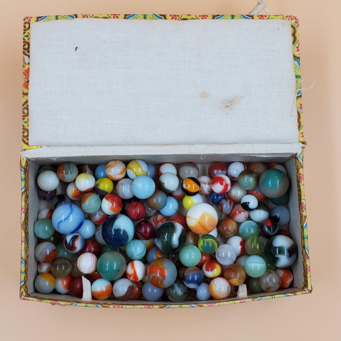 Box of Vintage Glass Marbles: Box of Vintage Glass Marbles. Please carefully read our terms of sale, shipping information, and request any condition reports or photos prior to placing a bid. Any condition statement is given as a c