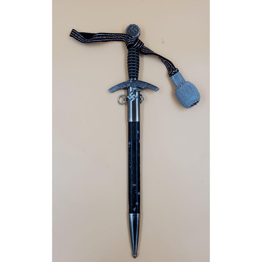 World War II Dagger: World War II Dagger. Measures 19" long with sheath. Please carefully read our terms of sale, shipping information, and request any condition reports or photos prior to placing a bid. Any condition sta