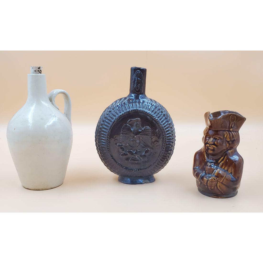 Lot of Jug, Flask & Bennington Toby Mug: Lot of Jug, Flask & Bennington Toby Mug. Please carefully read our terms of sale, shipping information, and request any condition reports or photos prior to placing a bid. Any condition statement is g