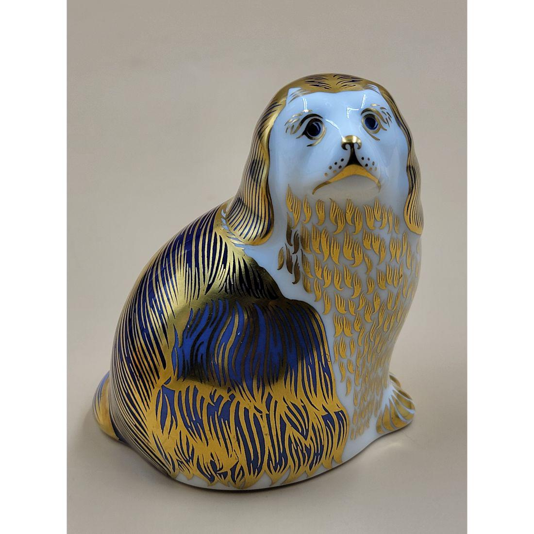 A Very Fine Royal Crown Derby Paperweight With Gold Stopper "A Spaniel Dog": A Very Fine Royal Crown Derby Paperweight With Gold Stopper "A Spaniel Dog". Measure 3 3/4" X 3.5" X 2 3/4". Please carefully read our terms of sale, shipping information, and request any condition re