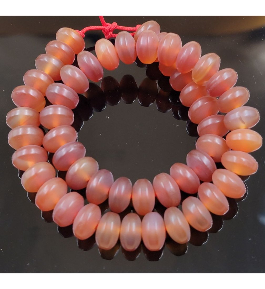 String Of Antique Agate/Carnelian Beads: Antique Agate/Carnelian Beads. Measure Approx. 12.8MM. This, and many lots forthcoming were found at the massive central Florida estate of a true antiquarian who amassed his magnificent collection ove