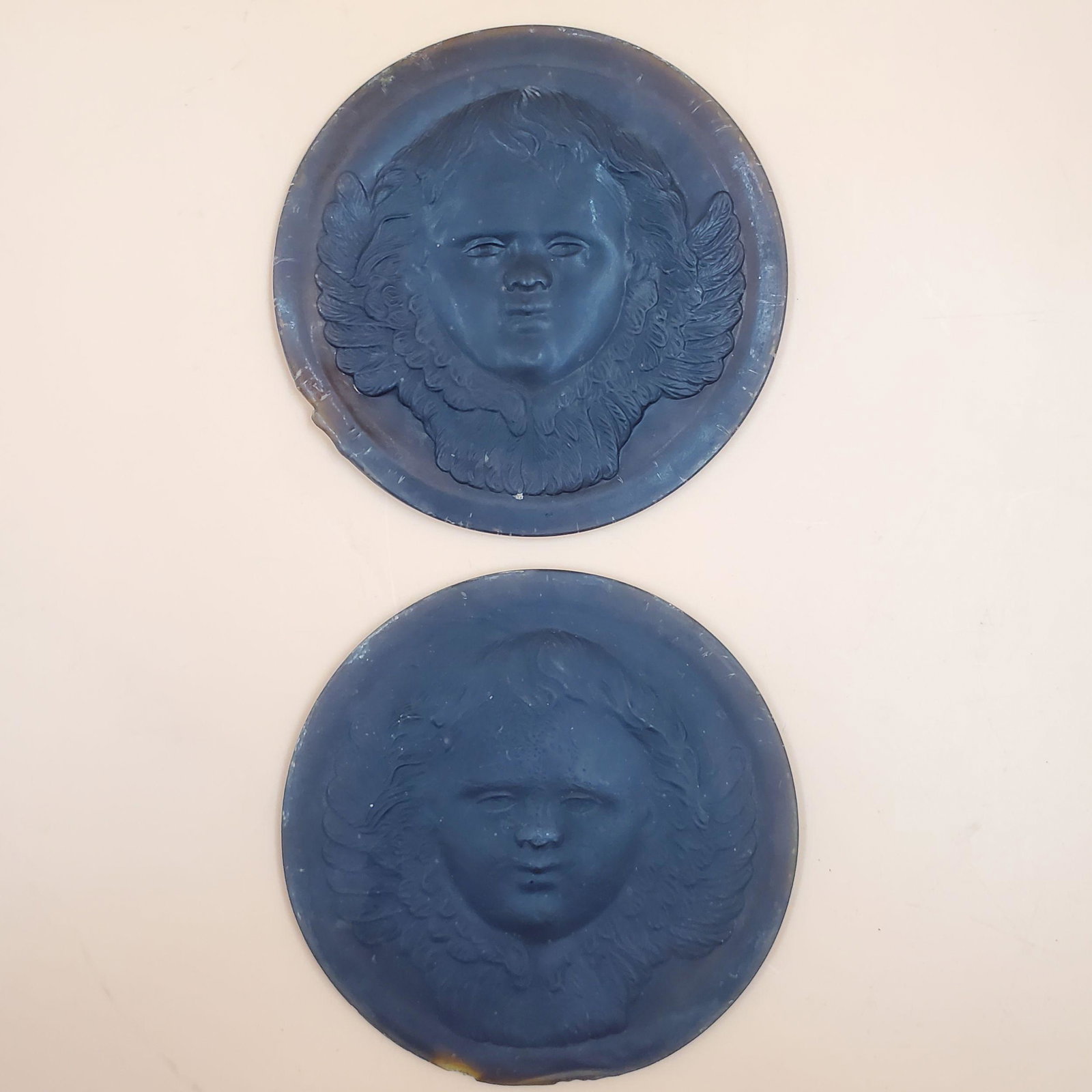Pair of Tiffany Studios Glass Cherub Roundels: Pair of Tiffany Studios Glass Cherub Roundels. Please carefully read our terms of sale, shipping information, and request any condition reports or photos prior to placing a bid. Any condition statemen