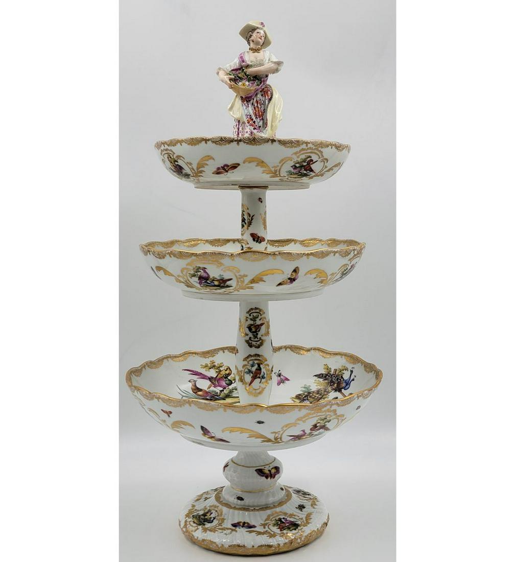 A Meissen Augustus Rex Porcelain Centerpiece Crowned By A Fine Sculptured Porcelain Figure: A Hand Painted Meissen Augustus Rex Porcelain Centerpiece Crowned By A Fine Sculptured Porcelain Figure. Measure Approx. 21" Tall. Please carefully read our terms of sale, shipping information, and re