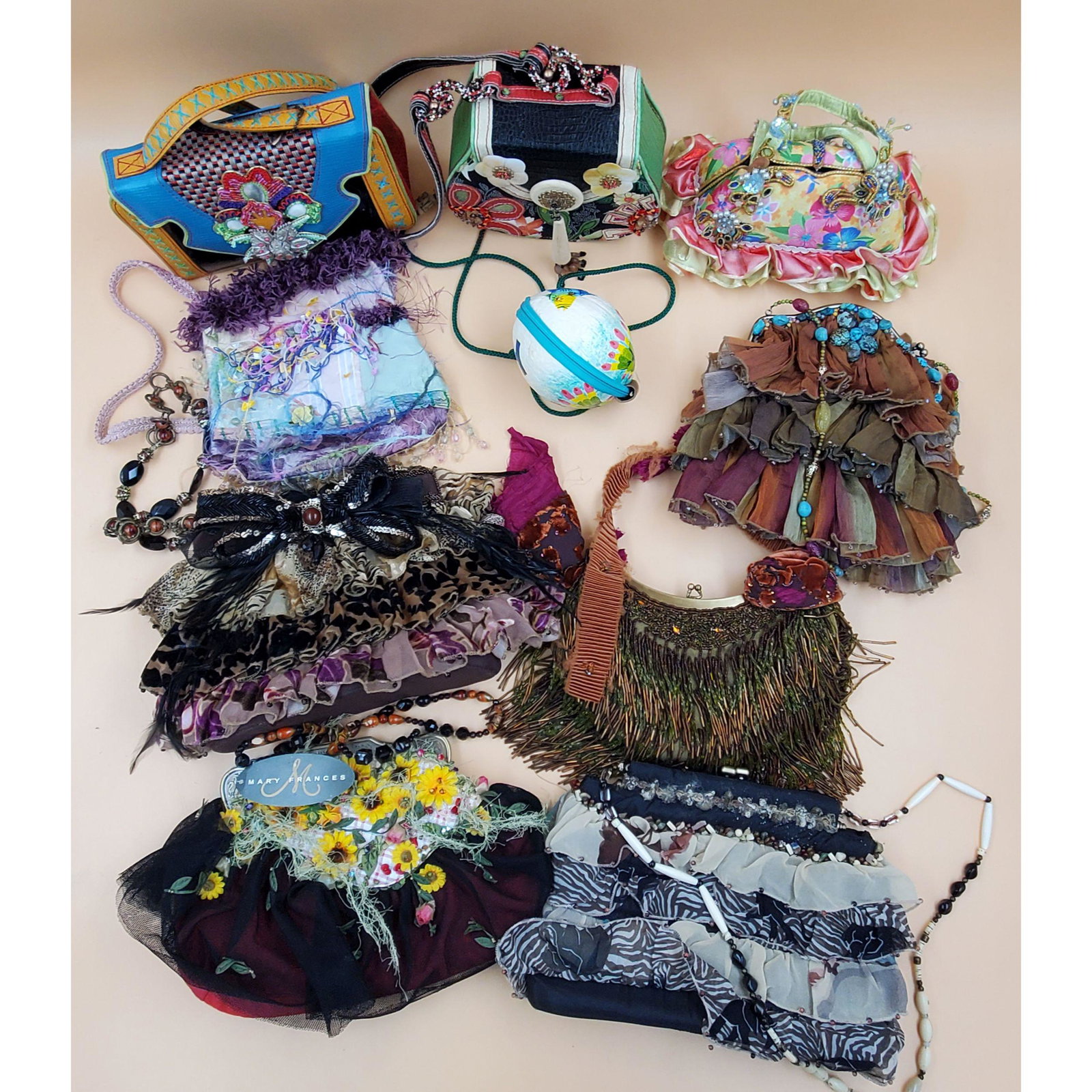 Lot of Designer Mary Frances Beaded Purses: Lot of Designer Mary Frances Beaded Purses. Many of the the purses are made by Mary Frances. One though is a coconut designed into a purse with fish designs. Please carefully read our terms of sale, s