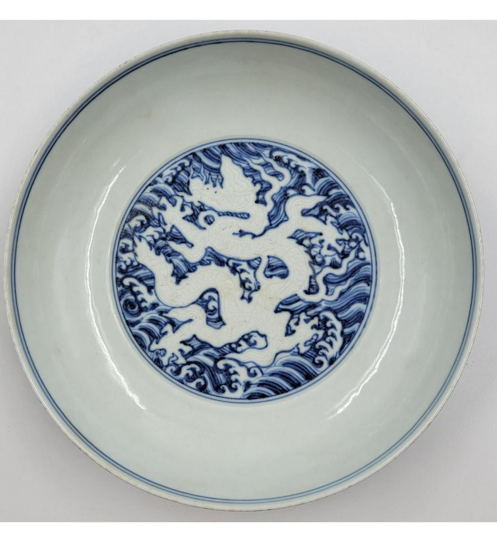 A Chinese Blue And White Dragon Dish With Xuande Mark Within Double Circles (1 of 15)