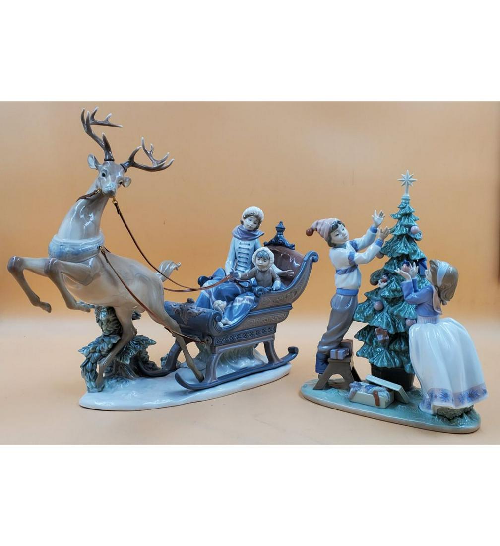 Pair of Lladros "Trimming The Tree" #5897 & "Winter Wonderland" #1429: Pair of Lladros "Trimming The Tree" #5897 & "Winter Wonderland" #1429(WITH ORIGINAL BOX). #5897 Measures Approx. 17" x 20 3/4" & #1429 Measures Approx. 4" x 10" x 14". Additional photos available upon