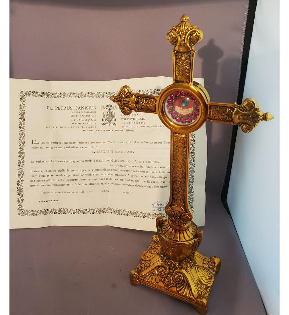 1St Class Relic Saint Martin De Porres With Authentication Document: 1St class relic of Saint Martin De Porres with authentication document. The relic is ex. Ossibus (bone), and is contained in a lovely red faceted jeweled theca. The theca is housed in a stately gothic