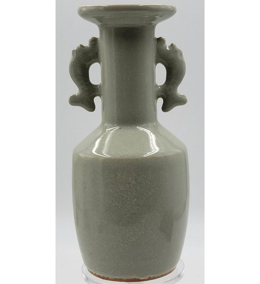A Chinese Celadon Porcelain Vase: A Chinese Celadon Porcelain Vase. Measure 8.5" Tall. Please carefully read our terms of sale, shipping information, and request any condition reports or photos prior to placing a bid. Any condition st