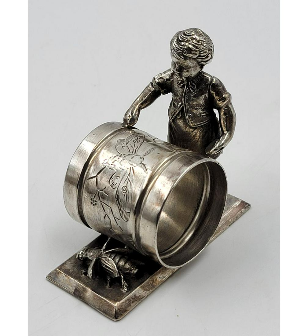 Vintage Silverplate Figural Napkin Ring: Vintage Silverplate Figural Napkin Ring. Measure 3 1/4" Tall. Please carefully read our terms of sale, shipping information, and request any condition reports or photos prior to placing a bid. Any con