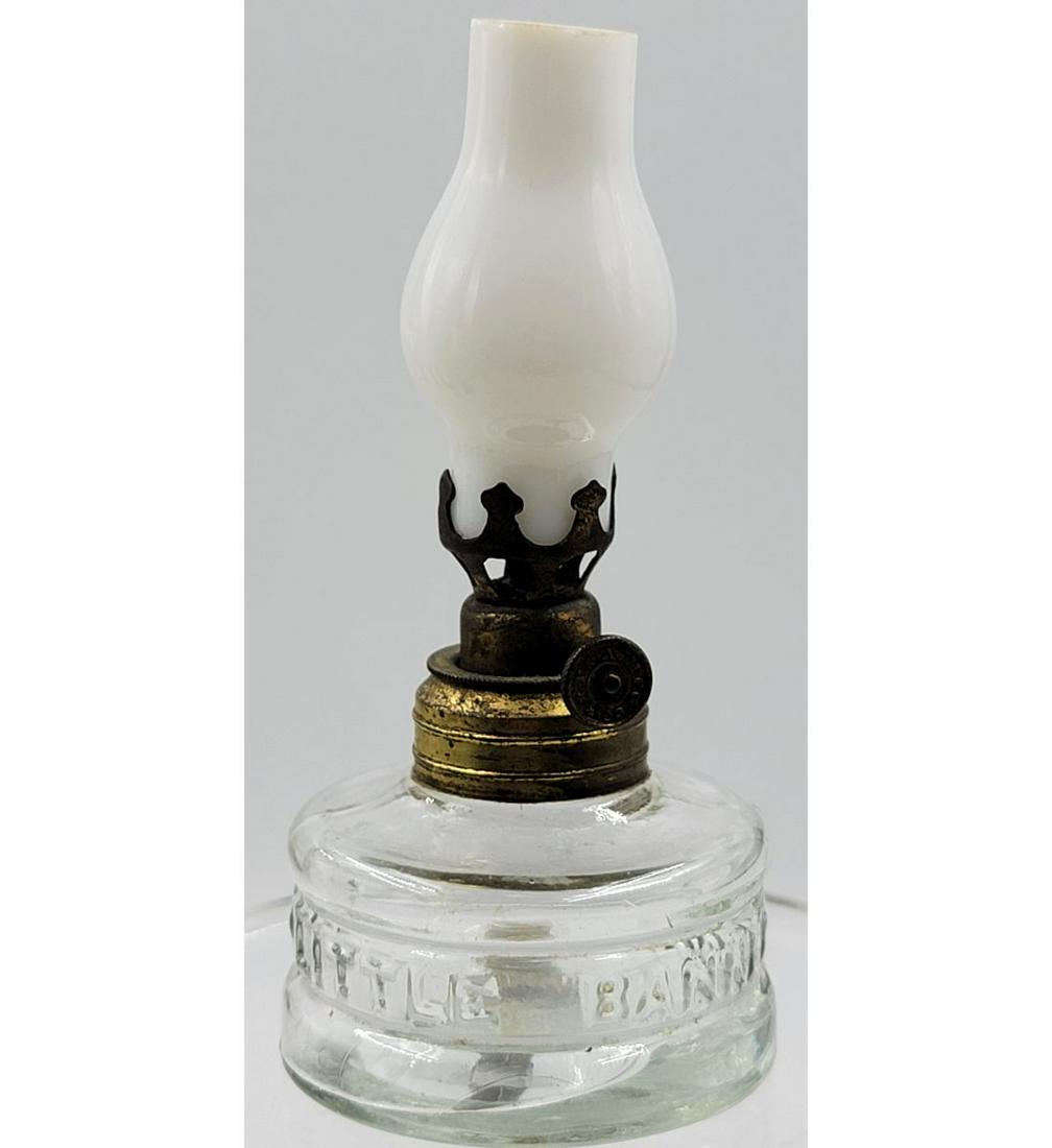 Miniature Oil Lamp Embossed "LITTYLE BANNER": Antique Miniature Oil Lamp, 4 3/4" Tall . Please carefully read our terms of sale, shipping information, and request any condition reports or photos prior to placing a bid. Any condition statement is