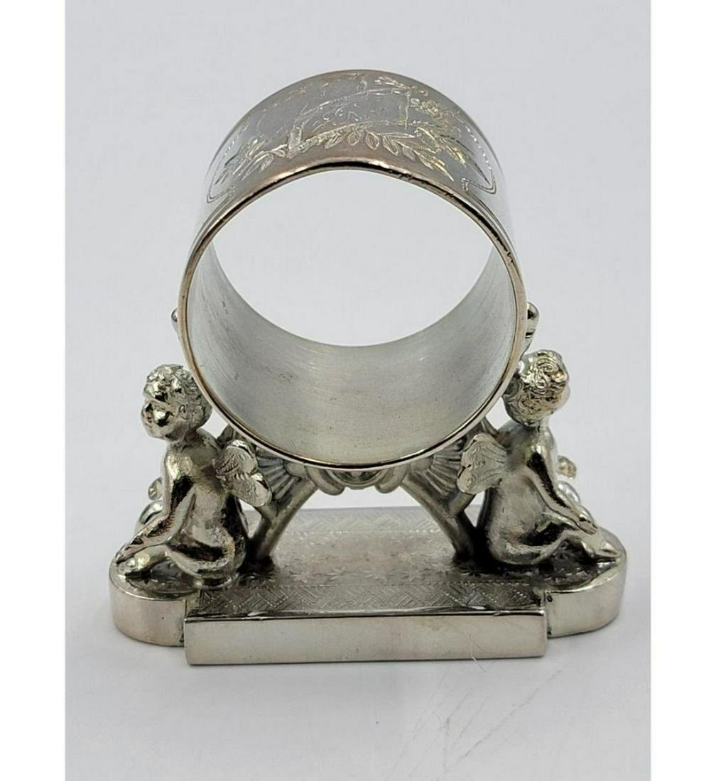 Vintage Silverplate Figural Napkin Ring: Vintage Silverplate Figural Napkin Ring. Measure 2 3/4" Tall. Please carefully read our terms of sale, shipping information, and request any condition reports or photos prior to placing a bid. Any con