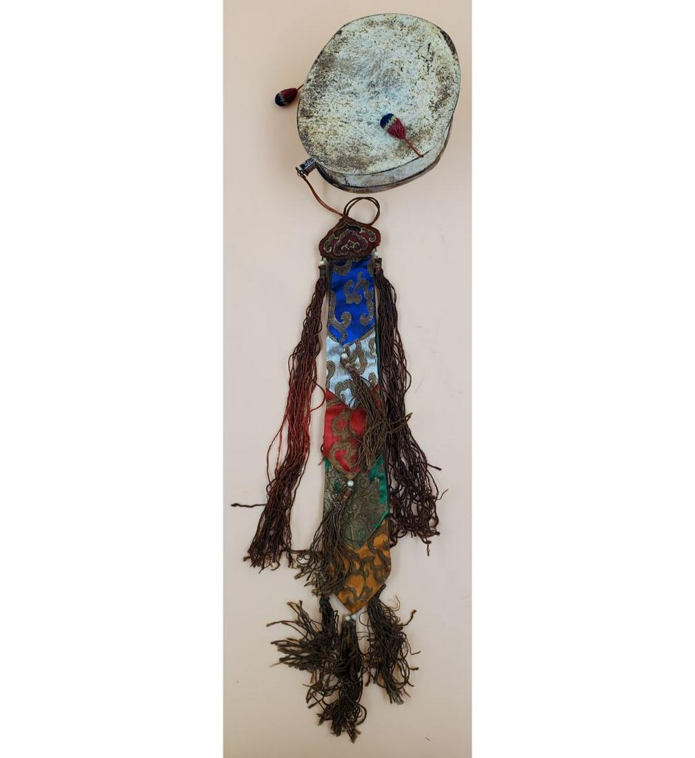 Tibetan Kapala Damaru: Tibetan Kapala Damaru. The Drum Measures 4 1/4" x 5" x 3"x, and with the Fabric, it measures 21 3/4" long. Please carefully read our terms of sale, shipping information, and request any condition repo