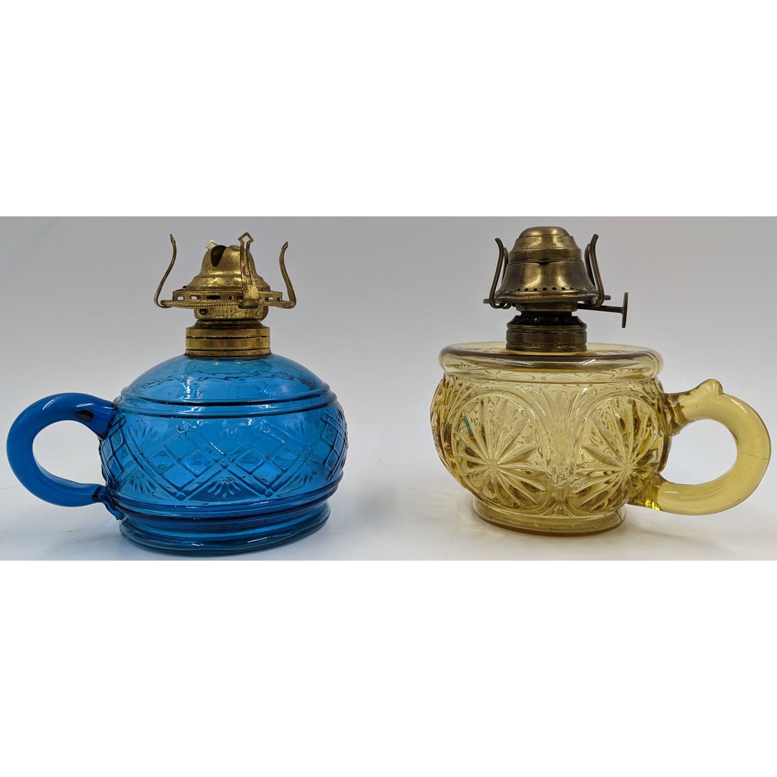 Pair Of 19th Century Miniature Oil Lamps: Pair Of 19th Century Miniature Oil Lamps. Measures approx. 5" tall. One lamp has a diamond sunburst design by the Walker & Co. The other lamp appears to be a feather duster design by the United States
