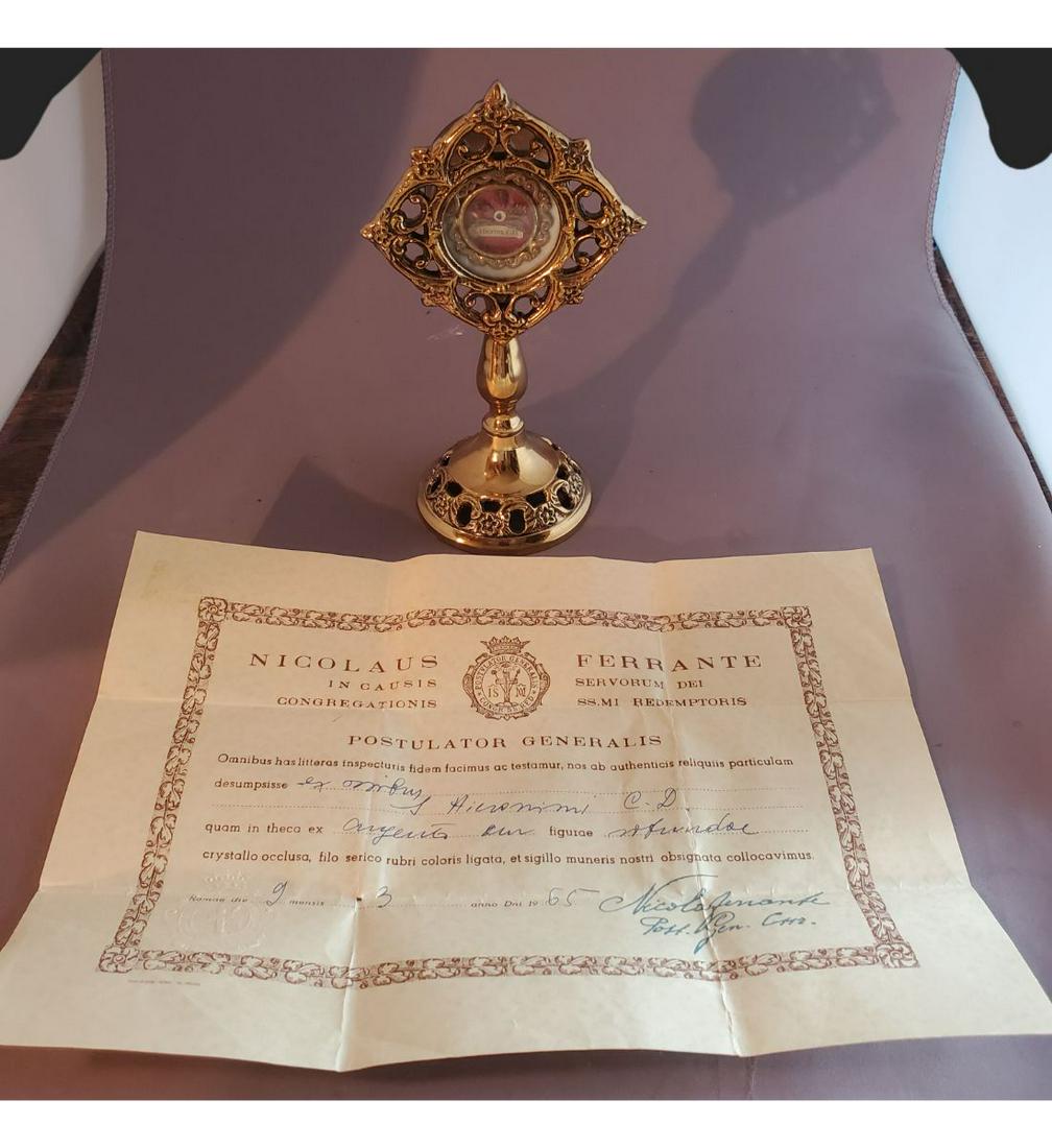 1st Class Relic Of Saint Jerome With Official Authentication Document: 1st Class Relic Of Saint Jerome With Official Authentication Document. The relic is ex. Ossibus (bone). The relic is contained in a fancy gold theca with nice nuns work to the interior. The theca is h