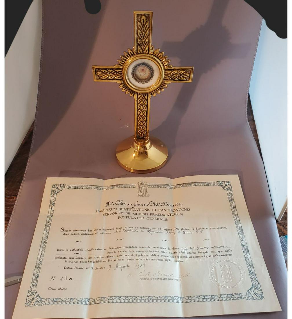 1st class relic of Saint Dominic Guzman, Founder Of The Dominicans, With Official Authentication Doc: 1st class relic of Saint Dominic Guzman, founder of the Dominicans, with official authentication document. The relic is ex. Ossibus (bone). The relic is contained in a very fancy silver filigree theca