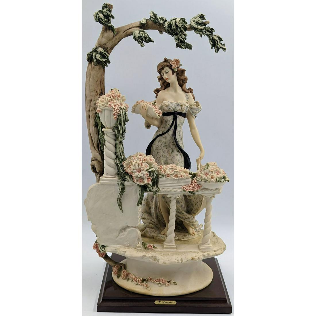 Giuseppe Armani Figurine: Flower Girl 696C: Giuseppe Armani Figurine: Flower Girl 696C. Measures approx. 18 1/2" X 9 1/4". Please carefully read our terms of sale, shipping information, and request any condition reports or photos prior to placi