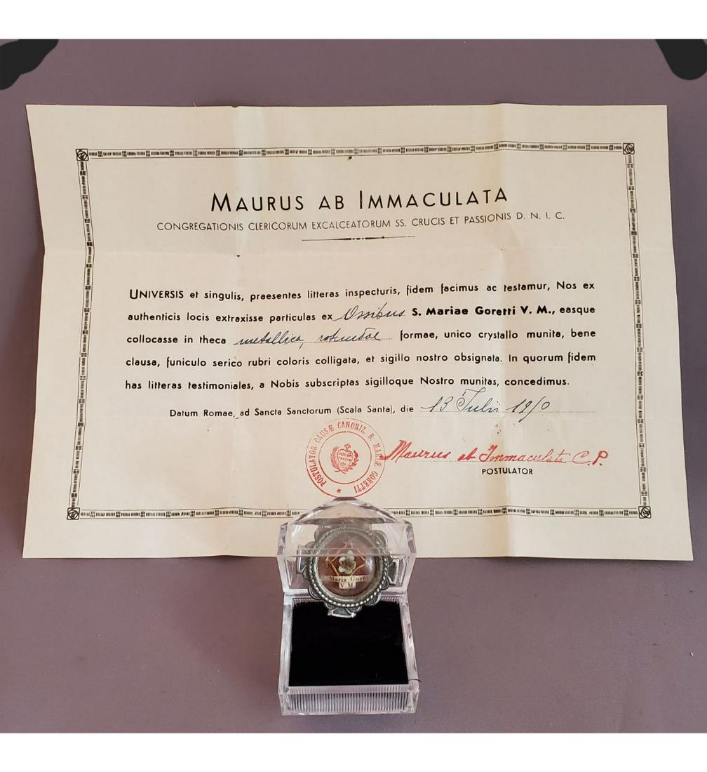 1st Class Relic Of Saint Maria Goretti, V M., With Authentication Document: 1st Class Relic Of Saint Maria Goretti, V M., With Authentication Document. The relic is ex. Ossibus ( bone), and housed in a very nice ornate silver theca with fancy nuns work to the interior. The th