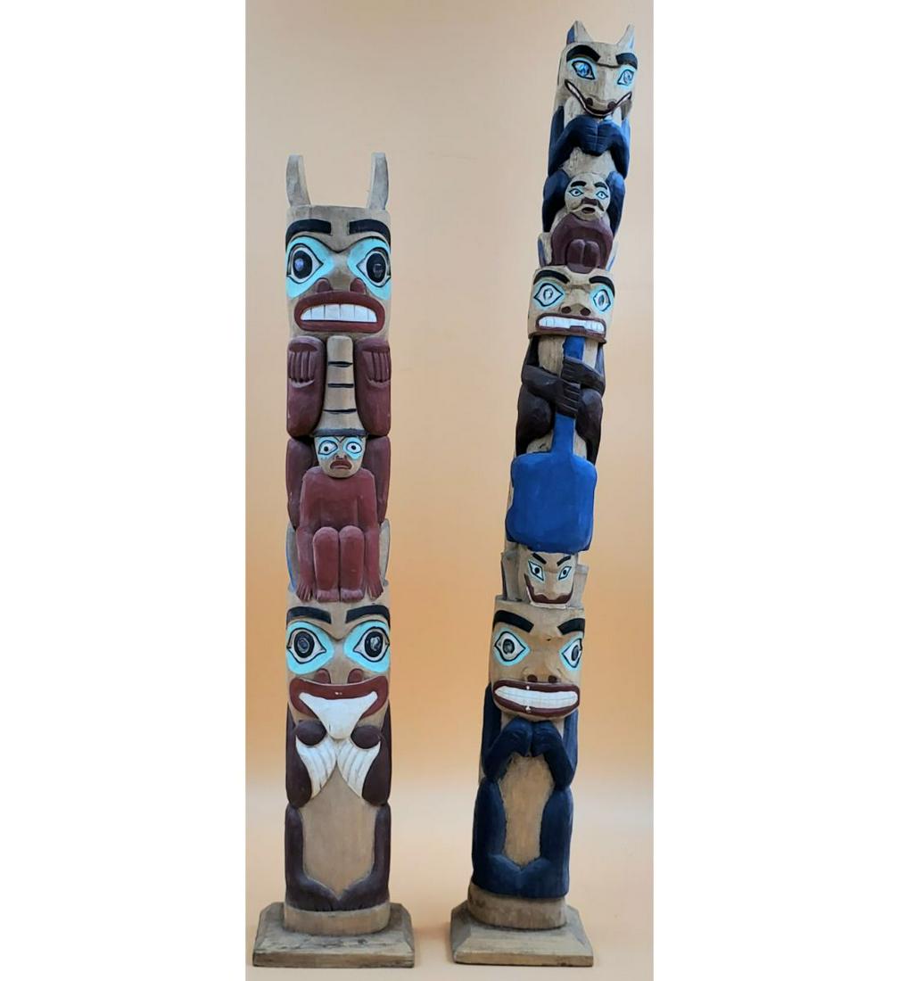 Pair of Pacific Northwest Miniature Totem Poles: Pair of Pacific Northwest Miniature Totem Poles. Measures 24" & 28 1/2" tall. Please carefully read our terms of sale, shipping information, and request any condition reports or photos prior to placin