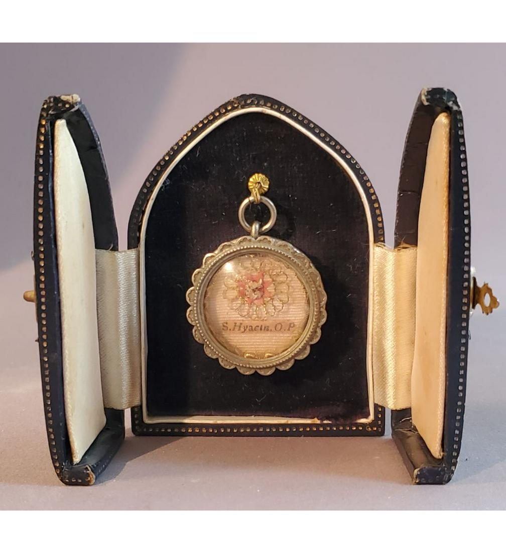 A Fine 1st Class Relic of Saint Hyacinth: A Fine 1st Class Relic of Saint Hyacinth, who was venerated as an Apostle of Poland, and credited with many miracles. The relic is contained in a fancy silver theca. The theca is housed in a Gothic ty